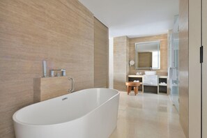 A modern bathroom with a freestanding bathtub, a wooden vanity, and a mirror above the sink. - The Westin Resort & Spa, Himalayas (Narendranagar)