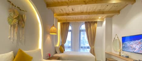 Standard Triple Room, Multiple Beds, Ground Floor | Pillow-top beds, individually decorated, desk, blackout curtains