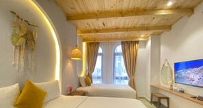 Standard Triple Room, Multiple Beds, Ground Floor | Pillow-top beds, individually decorated, desk, blackout curtains - Riverside Mini Hotel Grand World (Phu Quoc)