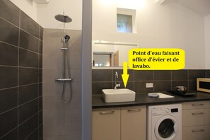 Shower, hair dryer, towels, toilet paper