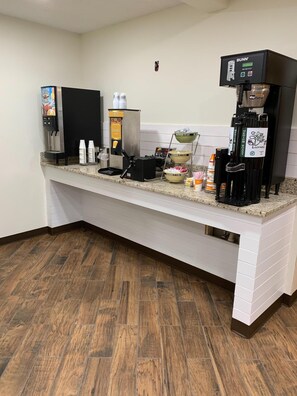 A coffee station with a Bunn espresso machine, a Keurig coffee maker, and a coffee urn. - Quality Inn & Suites Prestonsburg (Prestonsburg)