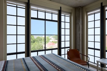 Room, 1 King Bed, Corner | Desk, travel crib, free WiFi, bed sheets at Moxy Charleston Downtown