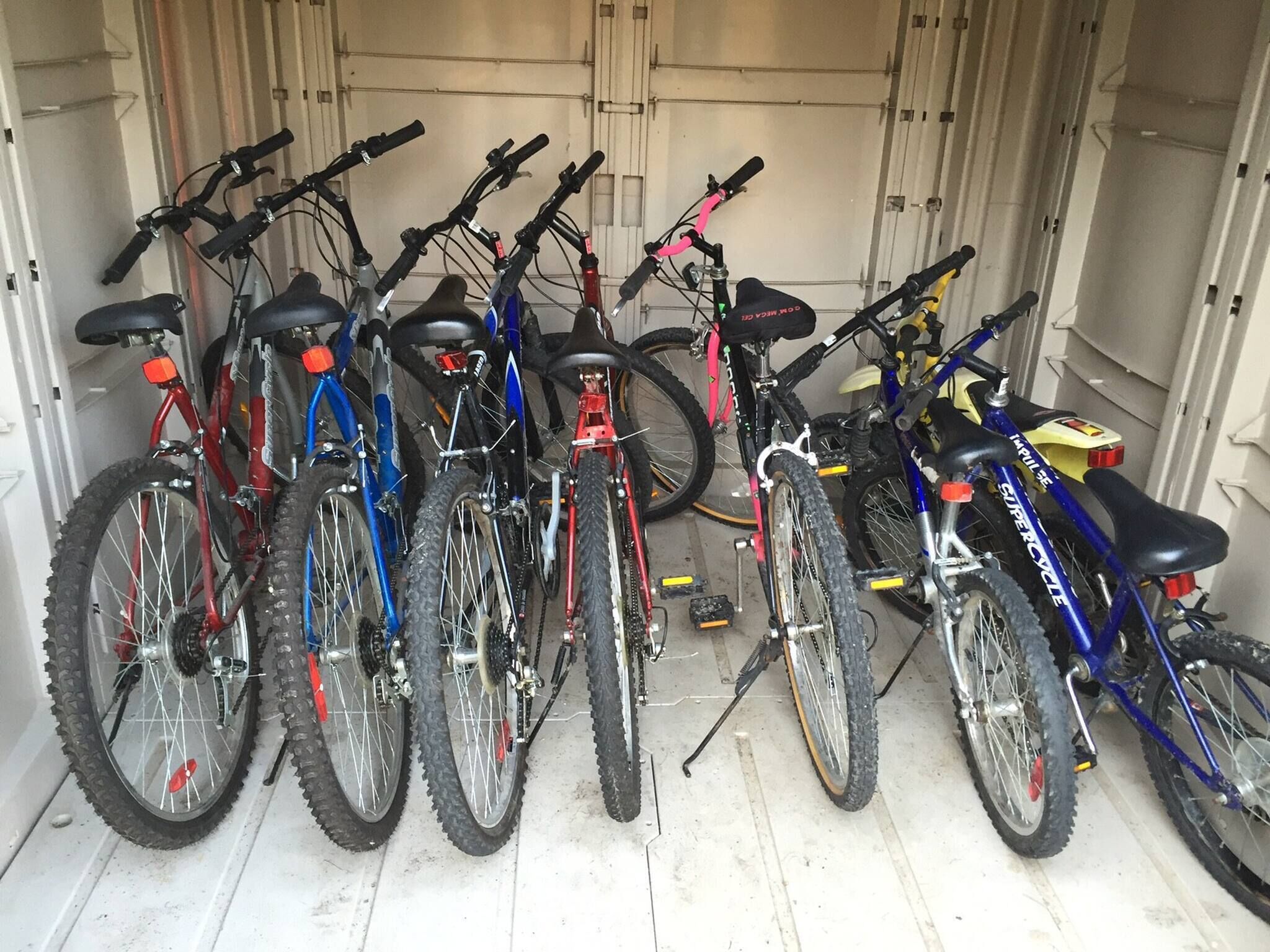 A row of bicycles parked inside a vehicle.