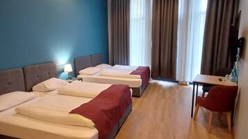 Standard Quadruple Room | Premium bedding, soundproofing, iron/ironing board, free WiFi