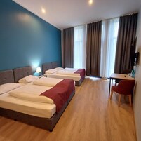 Standard Quadruple Room | Premium bedding, soundproofing, iron/ironing board, free WiFi