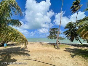 On the beach, sun-loungers, beach towels