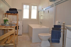 Bathtub, hair dryer, towels