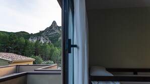 A balcony with a bed and a view of a mountain. - Las Ermitas de Vallada (Vallada)