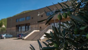 A building with a modern design, featuring a staircase leading to an entrance. - Las Ermitas de Vallada (Vallada)