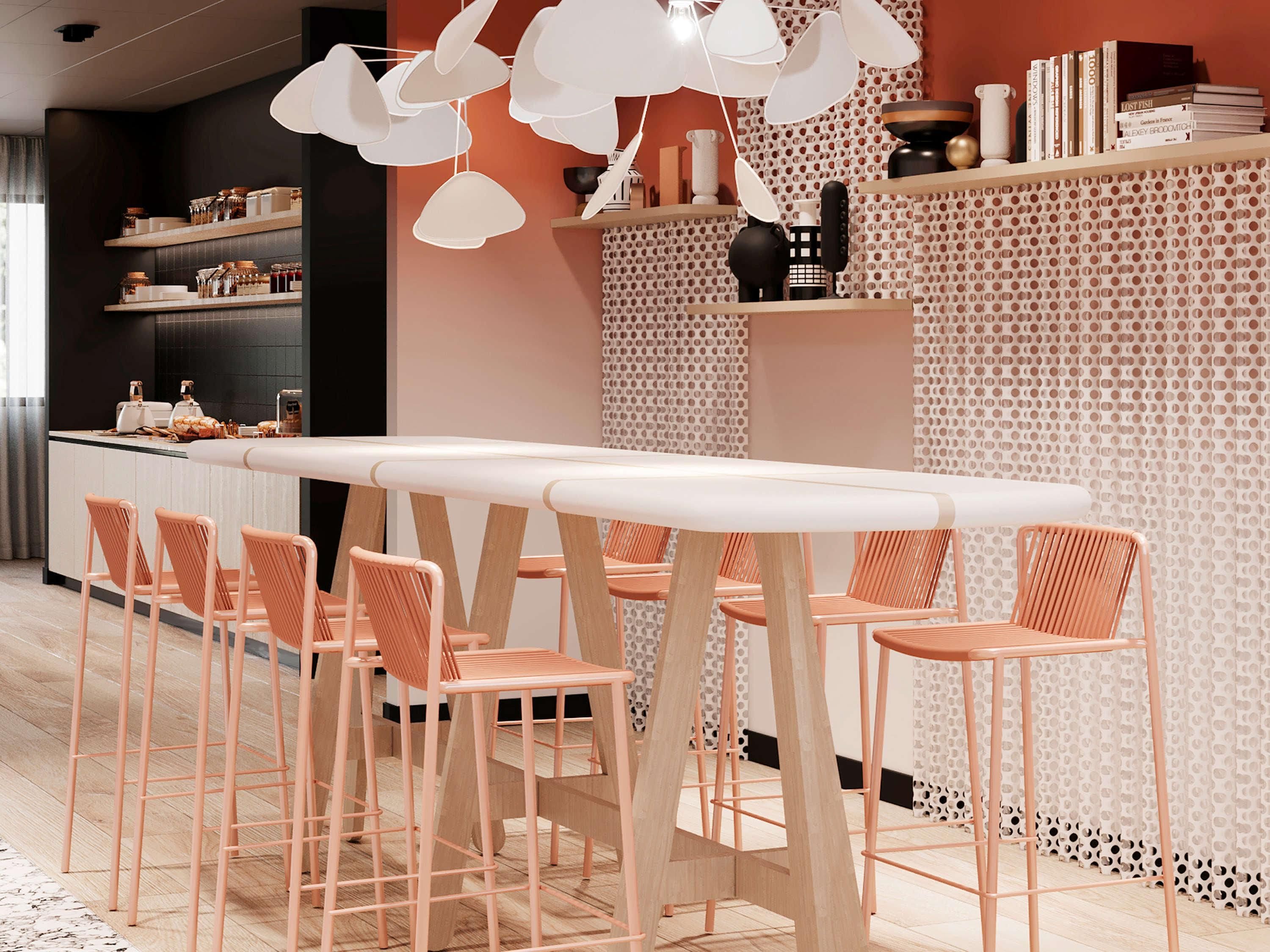A modern kitchen with a central island, bar stools, and pendant lighting.