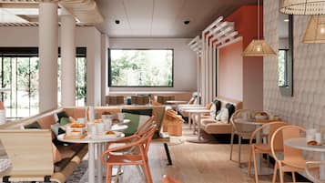 A modern cafe with round tables, orange chairs, and a large window offering a view of greenery.