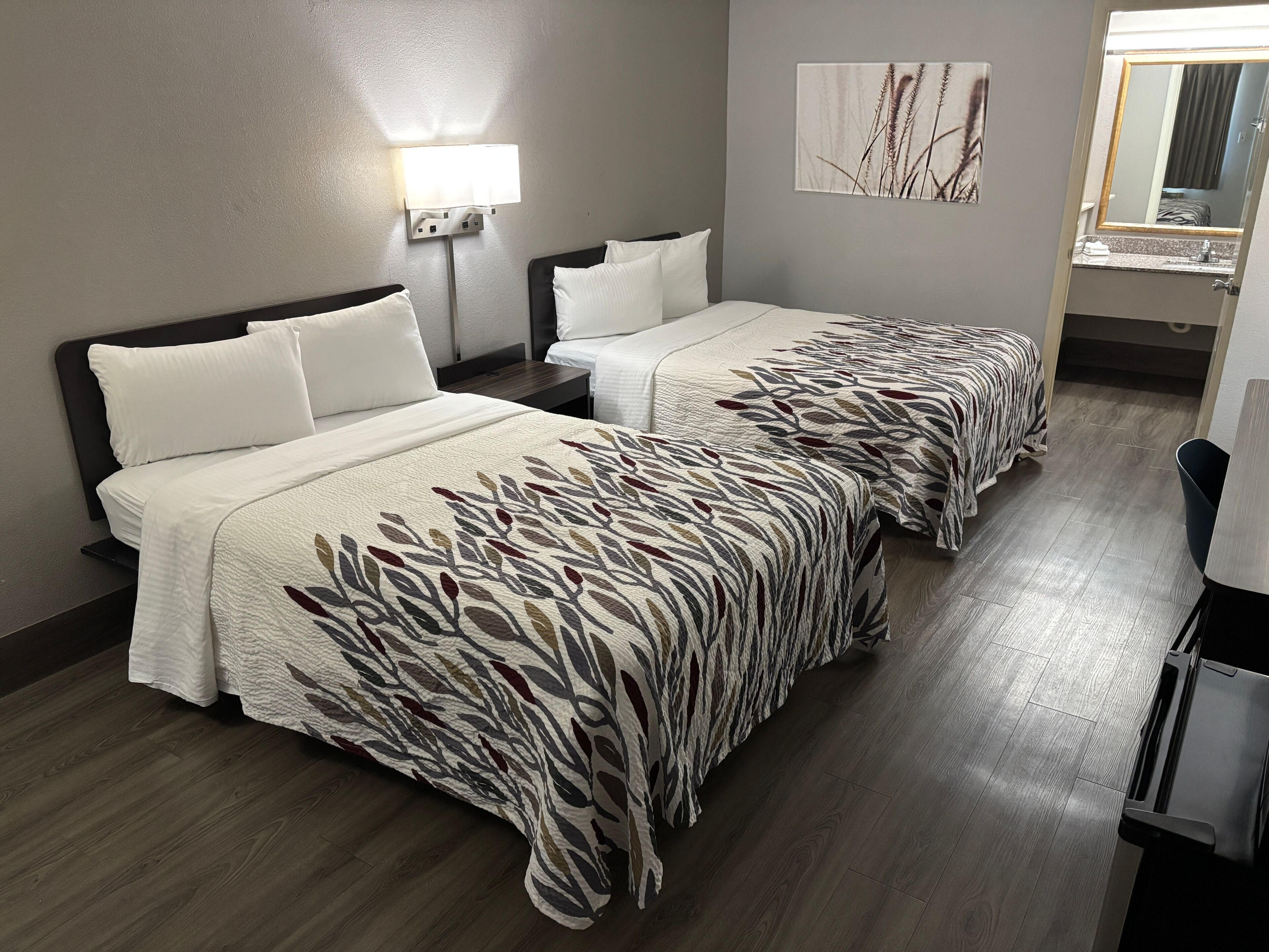 Premium bedding, desk, laptop workspace, blackout curtains