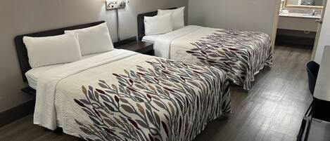 Premium bedding, desk, laptop workspace, blackout drapes