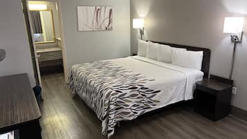 Premium bedding, desk, laptop workspace, blackout drapes