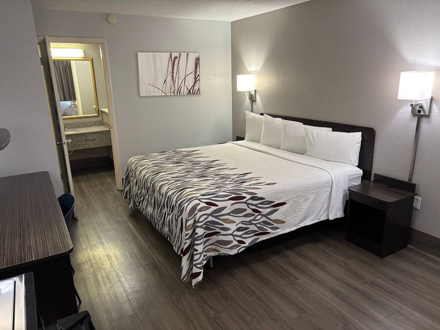 Premium bedding, desk, laptop workspace, blackout curtains