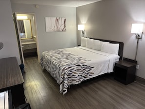 Premium bedding, desk, laptop workspace, blackout drapes