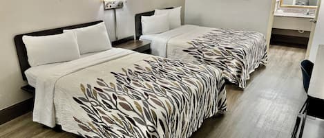 Premium bedding, desk, laptop workspace, blackout drapes