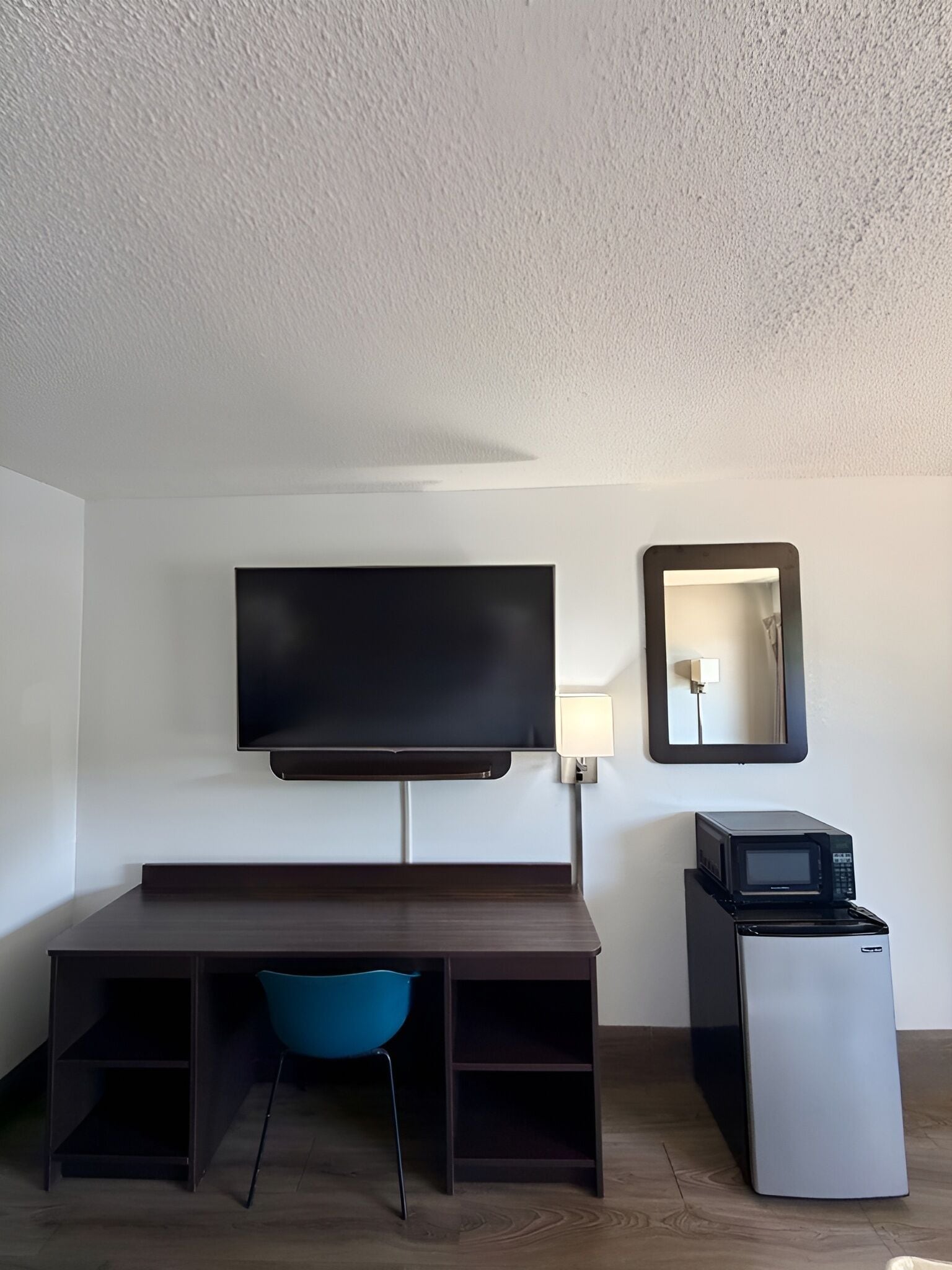 Premium bedding, desk, laptop workspace, blackout drapes