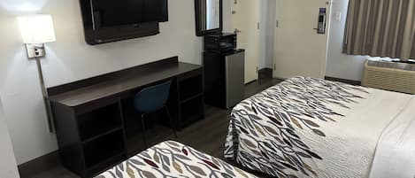Premium bedding, desk, laptop workspace, blackout drapes