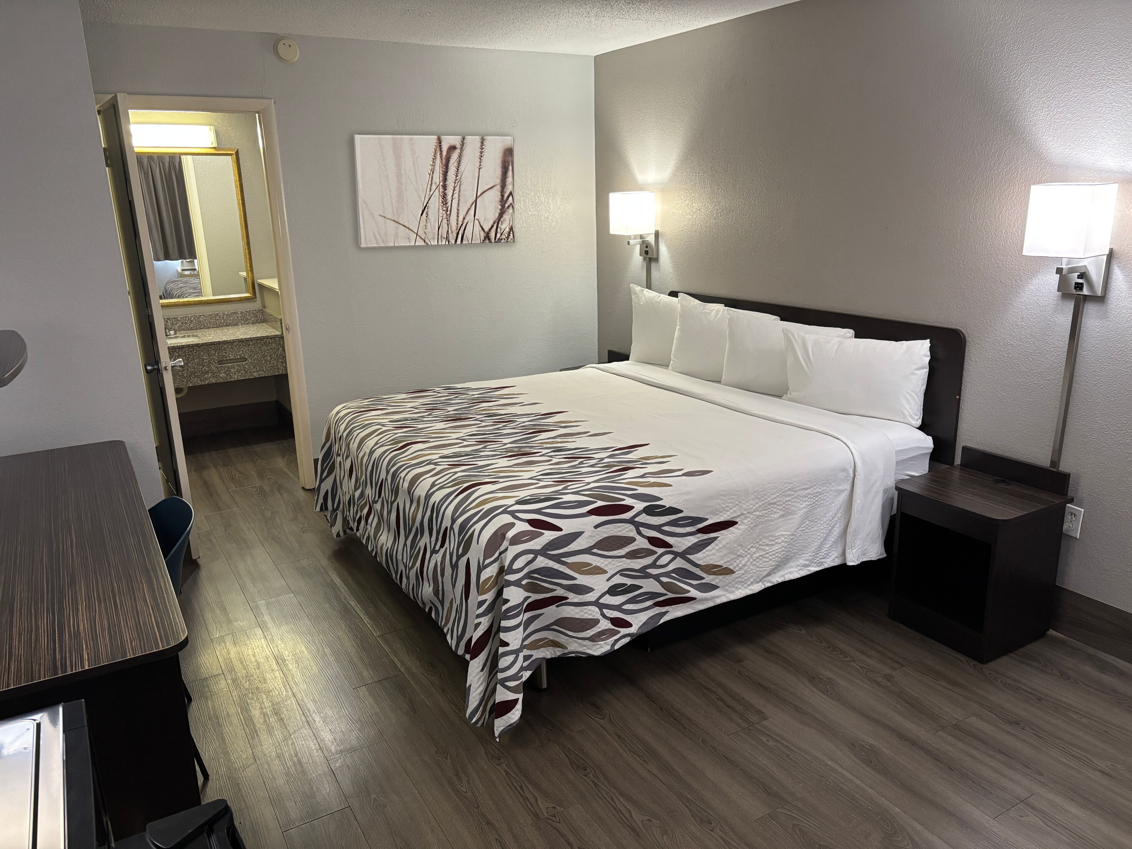Premium bedding, desk, laptop workspace, blackout curtains