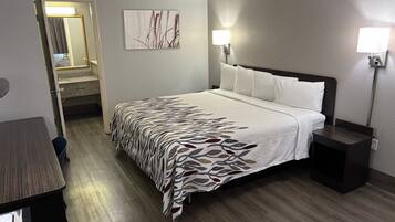 Premium bedding, desk, laptop workspace, blackout drapes