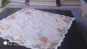 A room with a large arched doorway, a decorative mirror, and a lace doily on the floor. - House in Tangier (Tanger)