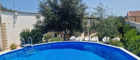 Seasonal outdoor pool, open 10:00 AM to 7:00 PM, pool loungers