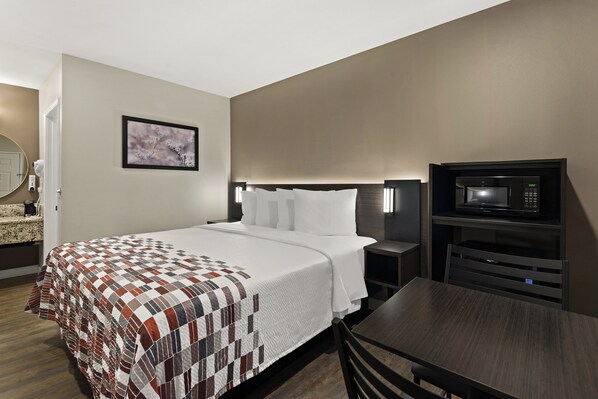 Desk, laptop workspace, free WiFi, bed sheets