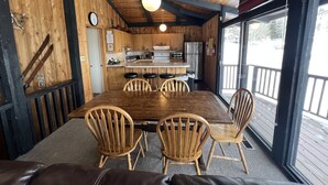 A wooden interior with a dining area, kitchen, and large windows. - Classic Chalet on free shuttle route-fireplace, hot tub and sauna.

5 Bedrooms (Snowmass Village)