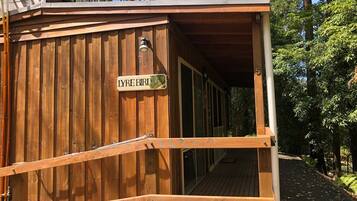 A wooden building with a sign reading "LYRE BIRD".
