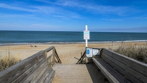 A wooden boardwalk leading to a beach with a signpost indicating beach rules. - 4002 - Duffy Duck - Heart of Duck Escape w/ Pool & Hot Tub (Duck)