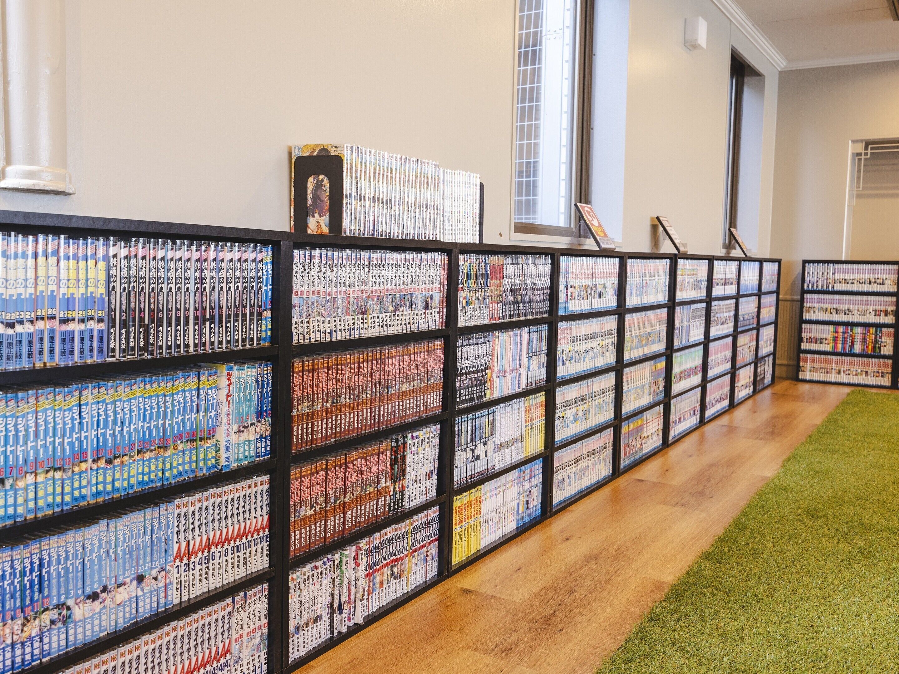 A library with bookshelves filled with books.