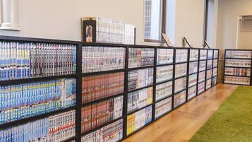 A library with bookshelves filled with books.