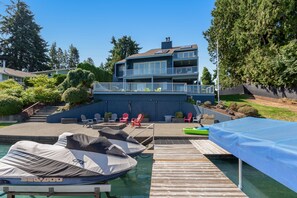 Exterior - Peaceful lakefront home with firepit, hot tub, pool table, dock, balcony, & deck (Lake Tapps)