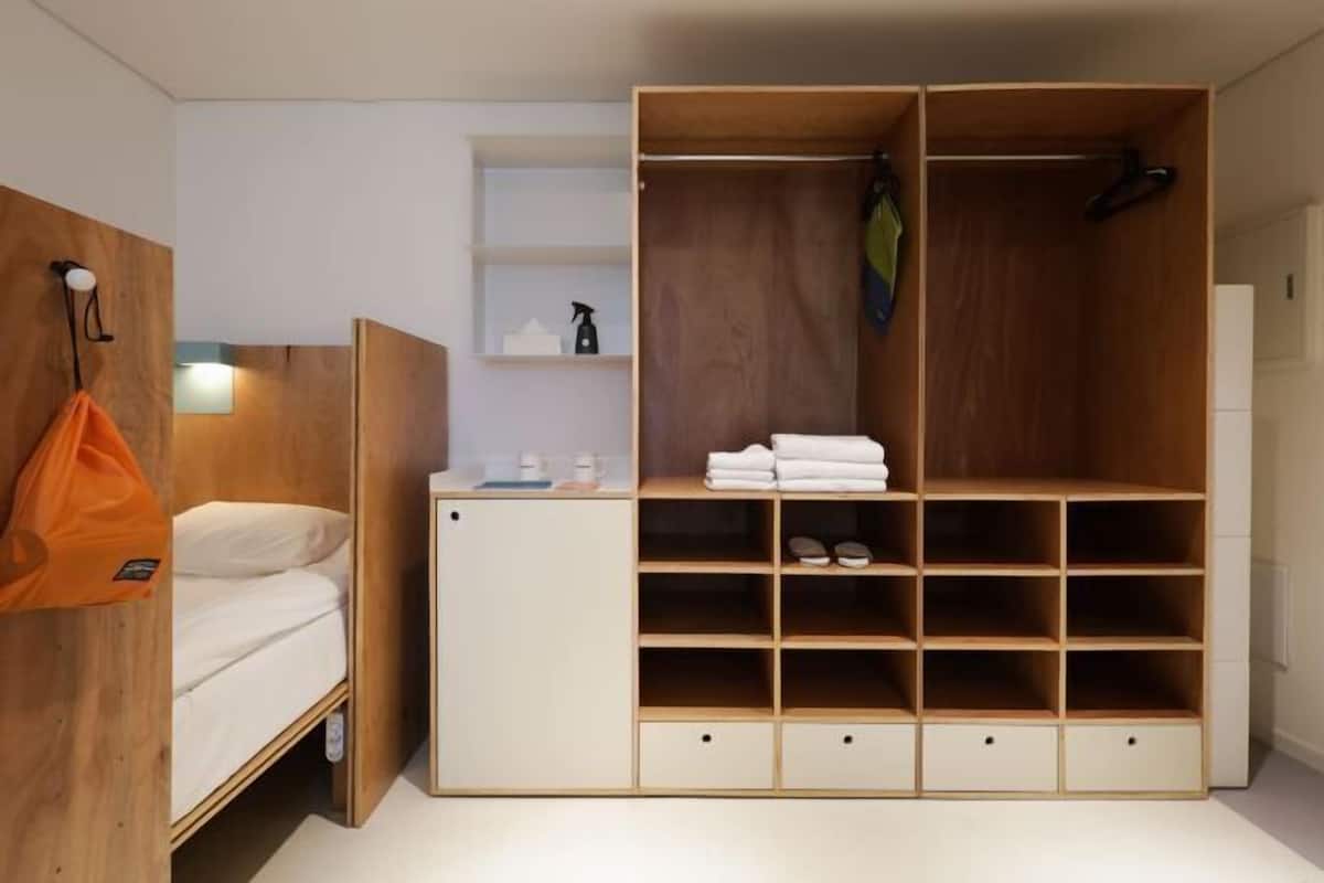 Premium bedding, memory foam beds, desk, laptop workspace