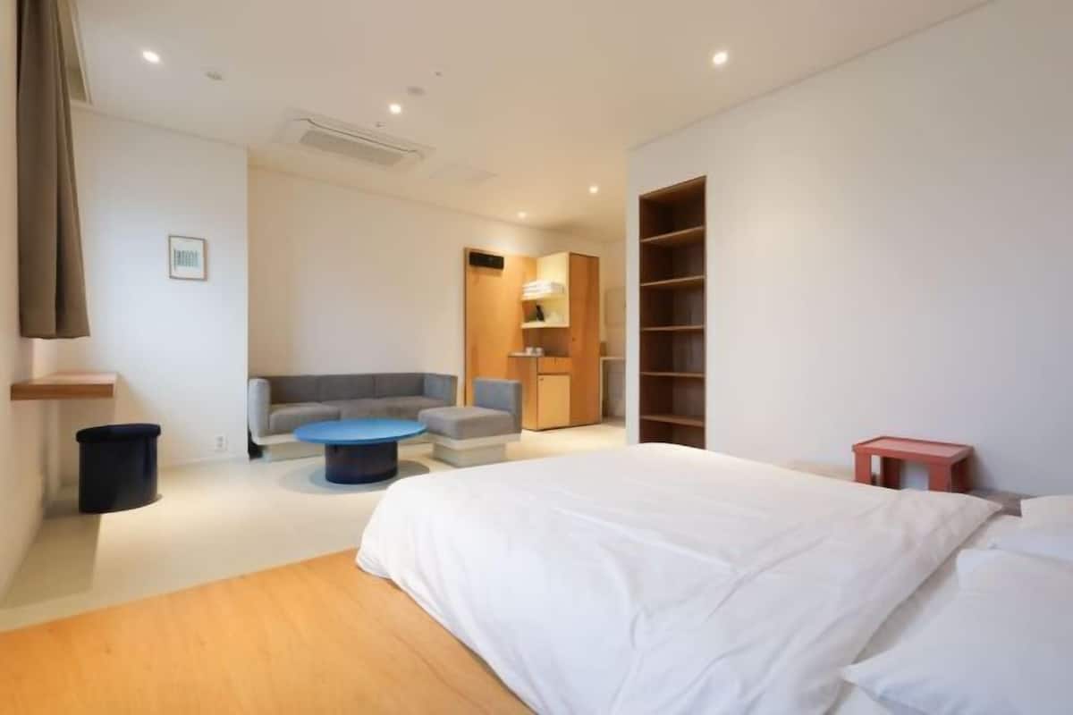 Premium bedding, memory foam beds, desk, laptop workspace