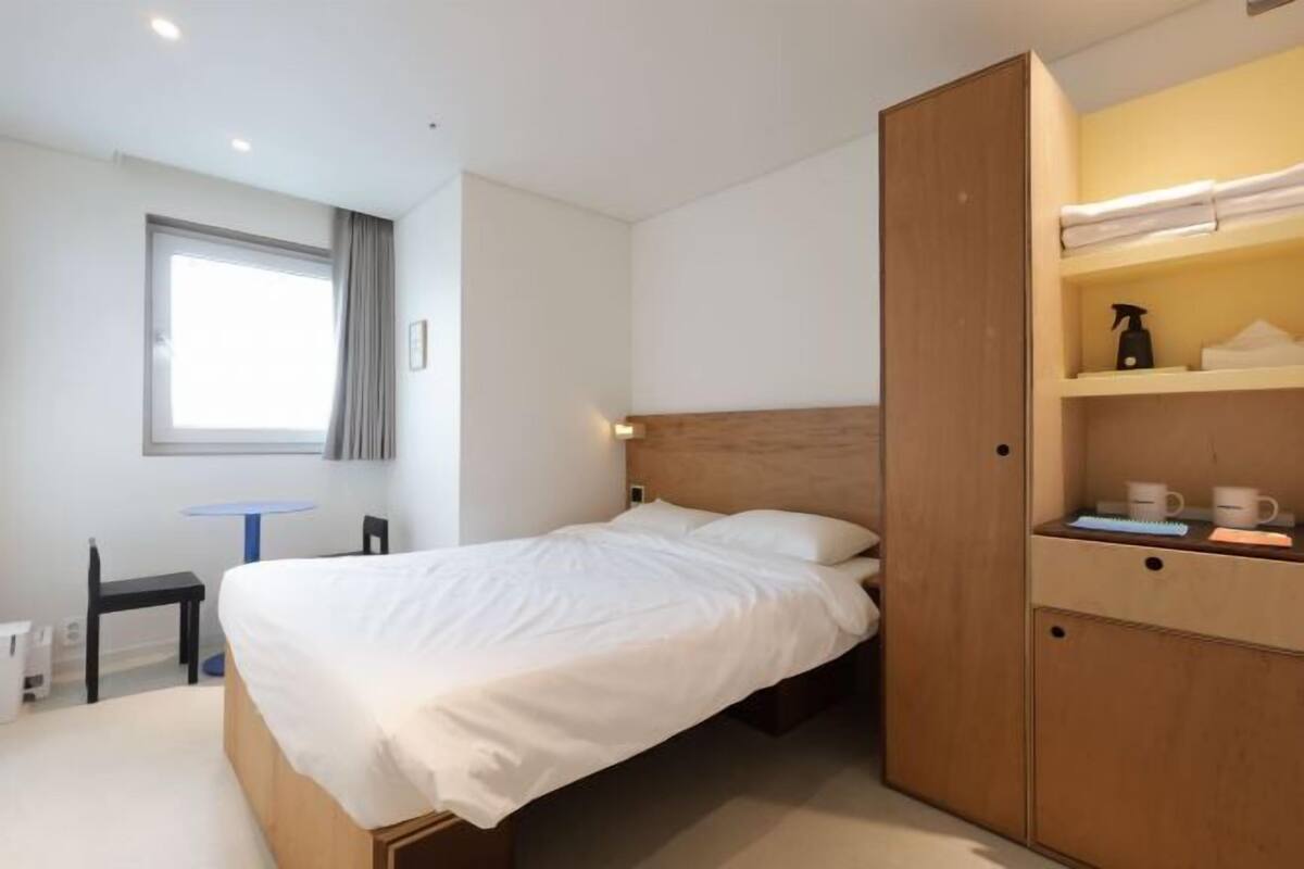 Premium bedding, memory foam beds, desk, laptop workspace