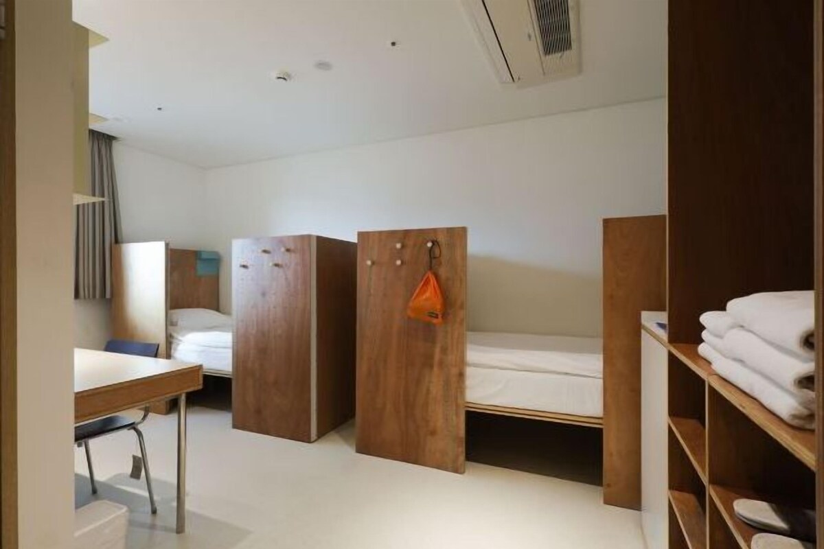 Premium bedding, memory foam beds, desk, laptop workspace