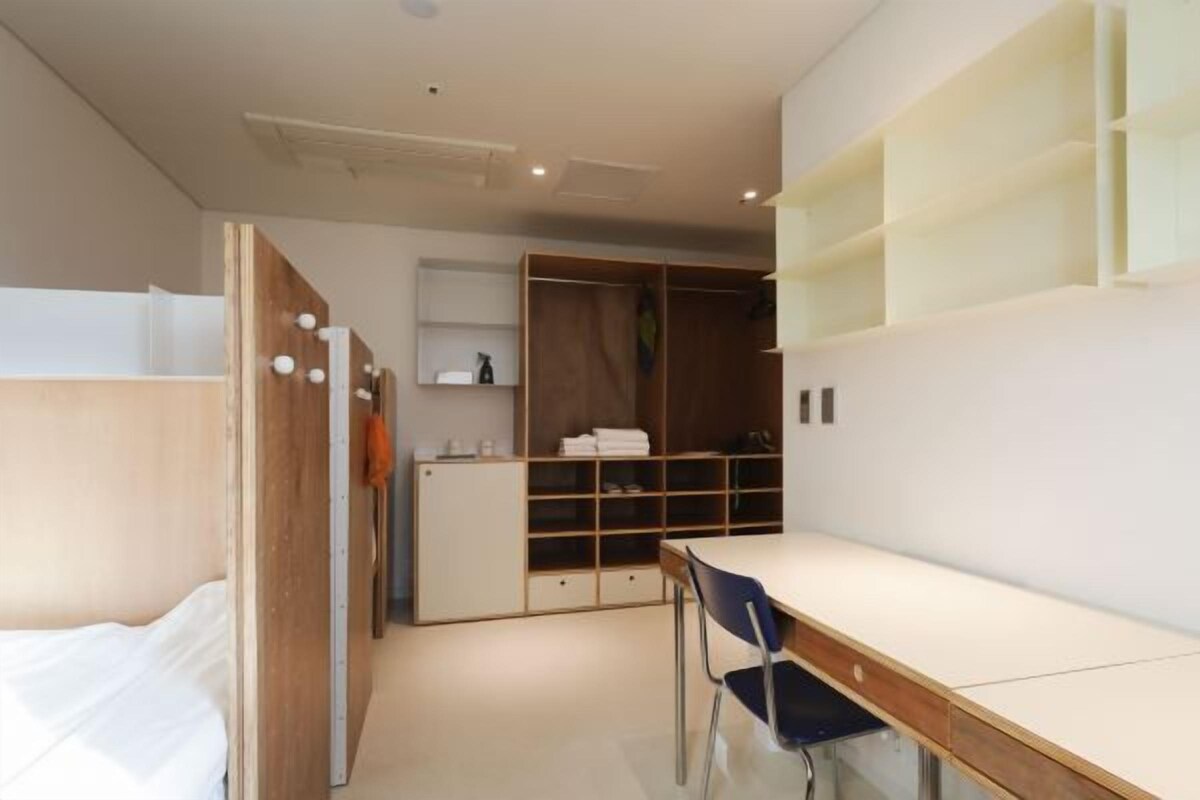 Premium bedding, memory foam beds, desk, laptop workspace