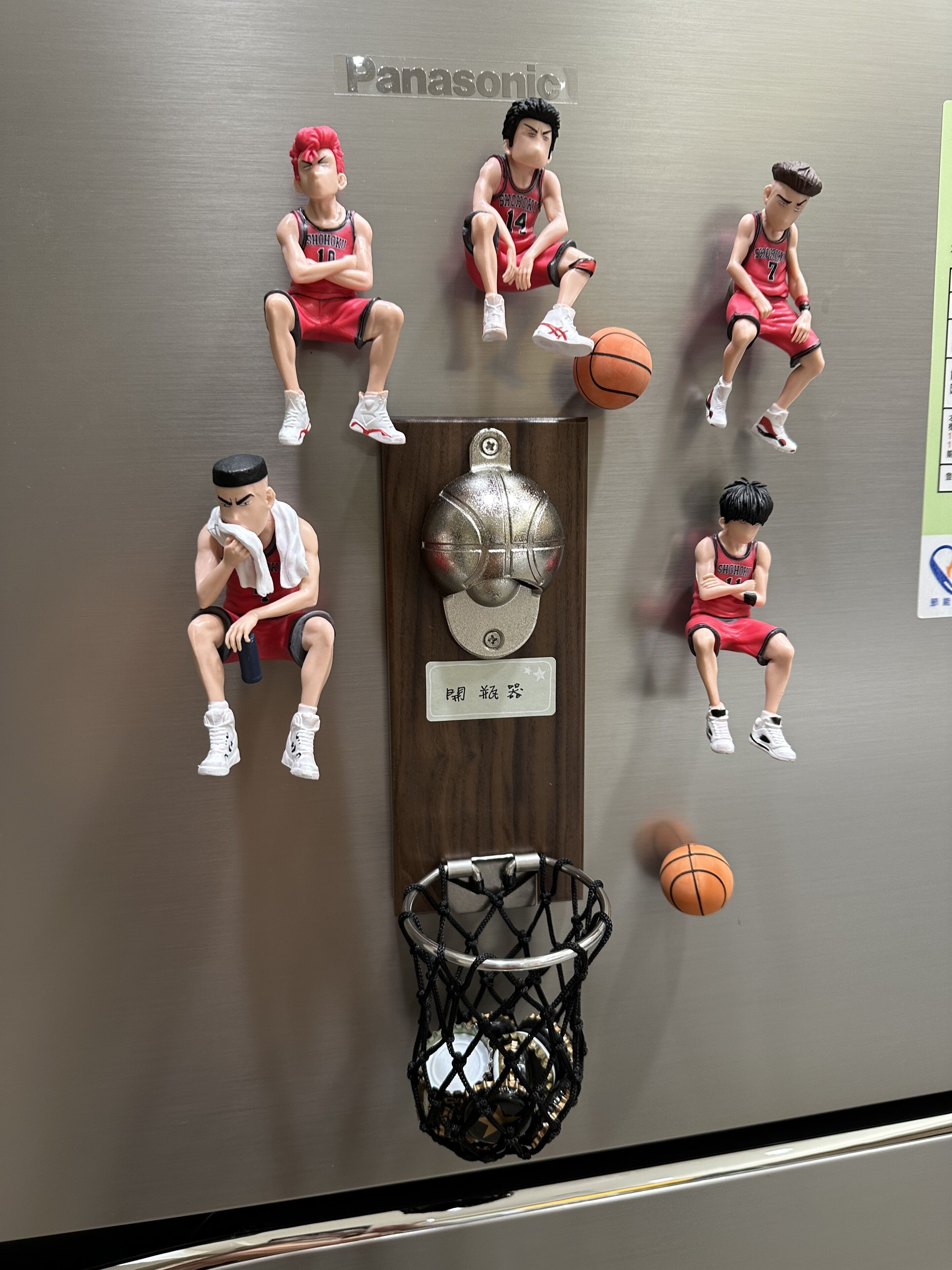 A wall with basketball-themed decorations, including figurines and a basketball hoop.