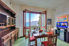 Family House, 2 Bedrooms, Mountainside (La Finestra Sul Lago) | Living room | Flat-screen TV