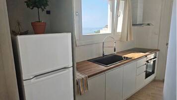 Fridge, microwave, cookware/dishes/utensils