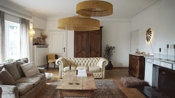 Deluxe Villa | Living area | 50-cm plasma TV with cable channels, TV