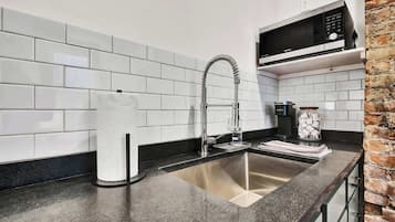 Microwave, coffee/tea maker, cookware/dishes/utensils