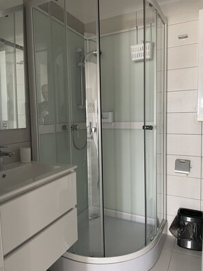 Shower, hair dryer, towels, soap
