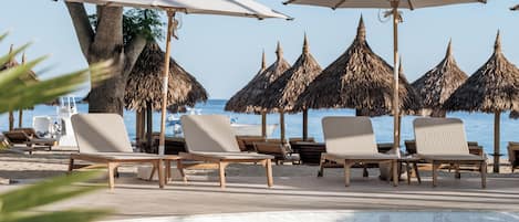 3 outdoor pools, open 8:00 AM to 6:30 PM, pool umbrellas, pool loungers