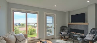 All-New Condo Steps from the Beach