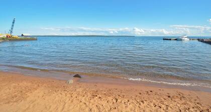 All-New Condo Steps from the Beach