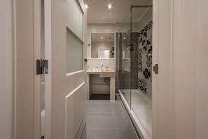 Bathtub, eco-friendly toiletries, hair dryer, bidet