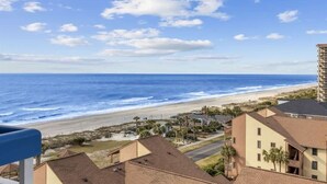 A coastal view with a beach, ocean, and buildings with balconies. - Peaceful Cabana Section*Indoor/Outdoor Pools*Mc61 (Myrtle Beach)
